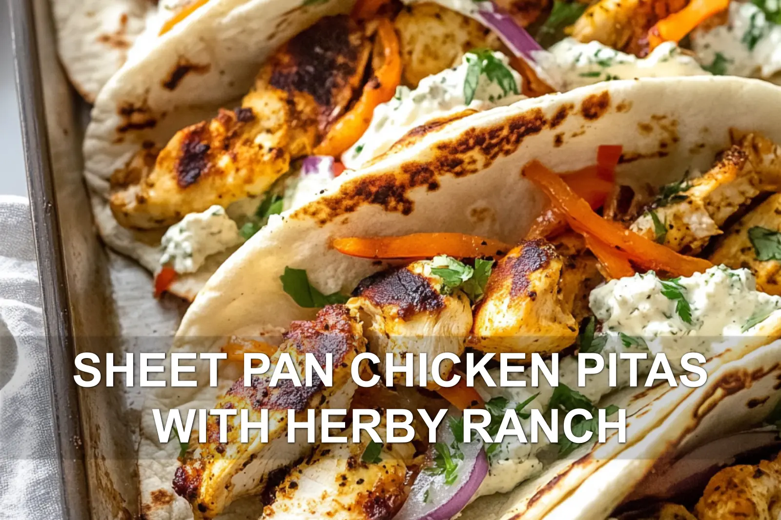 SHEET PAN CHICKEN PITAS WITH HERBY RANCH centered hero view, clean and uncluttered