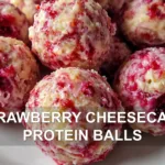 STRAWBERRY CHEESECAKE PROTEIN BALLS centered hero view, clean and uncluttered