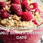HIGH PROTEIN RASPBERRY PEANUT BUTTER OVERNIGHT OATS centered hero view, clean and uncluttered
