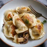 POLISH SAUERKRAUT AND MUSHROOM PIEROGI centered hero view, clean and uncluttered