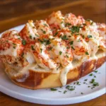 GARLIC BUTTER LOBSTER ROLLS centered hero view, clean and uncluttered