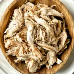 SLOW COOKER SHREDDED CHICKEN centered hero view, clean and uncluttered