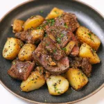 GARLIC BUTTER STEAK AND POTATOES centered hero view, clean and uncluttered
