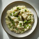 RISOTTO WITH ASPARAGUS AND PEAS centered hero view, clean and uncluttered