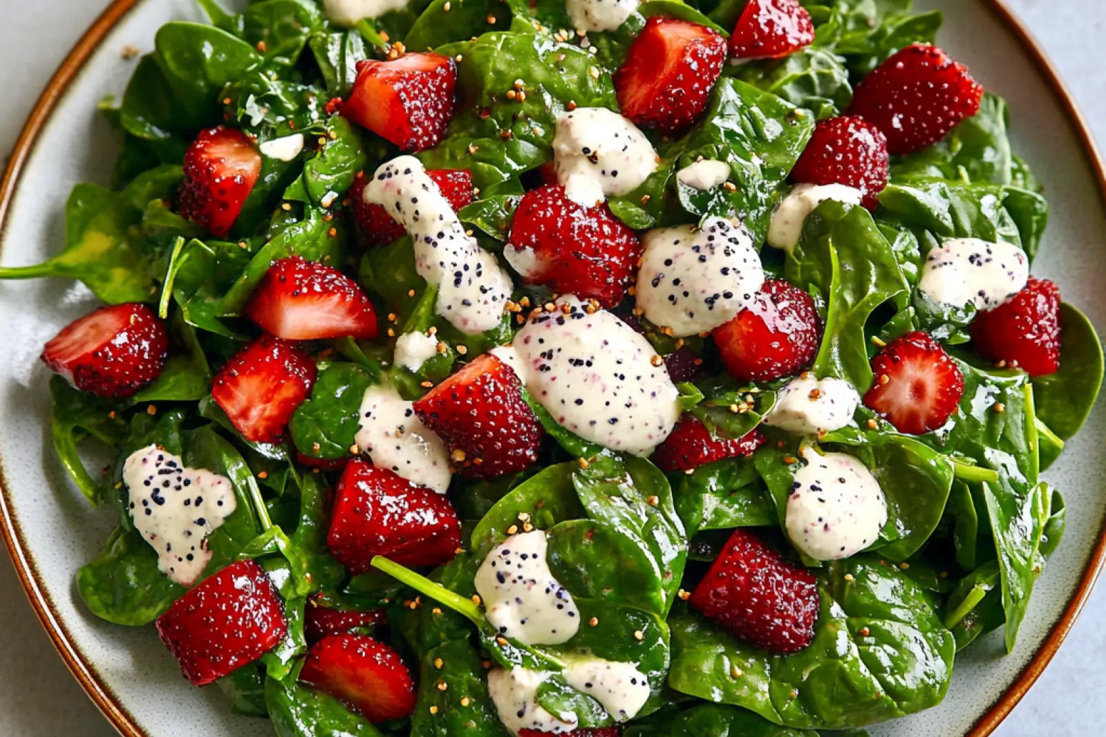 STRAWBERRY SPINACH SALAD WITH POPPY SEED DRESSING centered hero view, clean and uncluttered