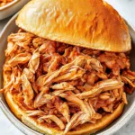 SLOW COOKER PULLED CHICKEN SANDWICHES recipe, served and ready to eat, easy homemade dinner